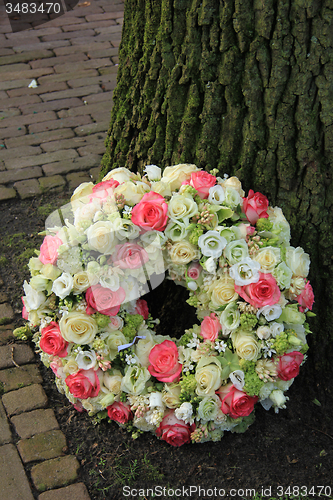 Image of Sympathy wreath near tree