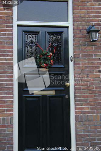 Image of Front door with Christmas decorations