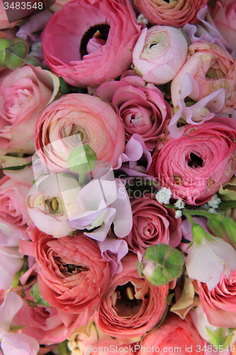 Image of Pink roses and ranunculus bridal bouquet