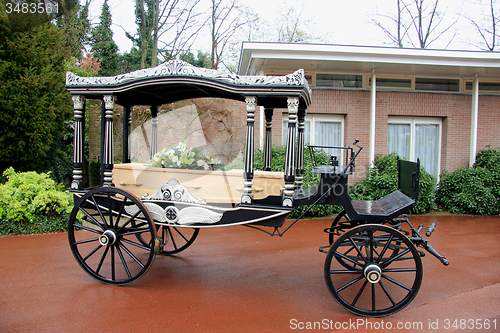 Image of Classic funeral carriage with coffin