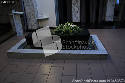 Image of Coffin with funeral flowers