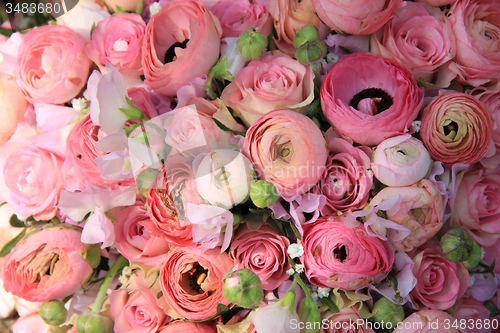 Image of Pink roses and ranunculus bridal bouquet