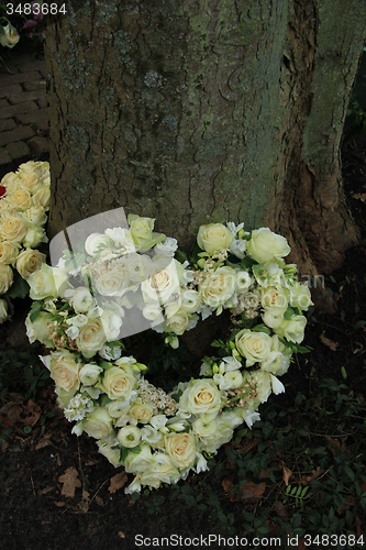 Image of Heart shaped sympathy flowers