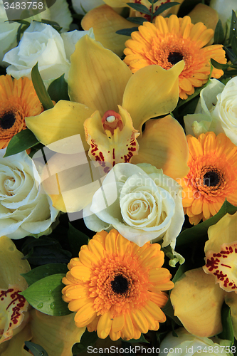 Image of Cymbidium orchids, Gerberas and roses