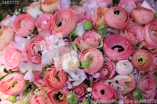 Image of Pink roses and ranunculus bridal bouquet