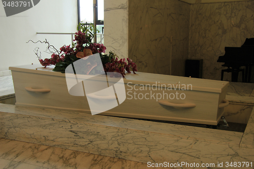 Image of Funeral flowers on a casket