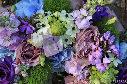 Image of Blue and purple wedding arrangement