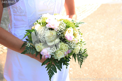 Image of Bride holding bouquet