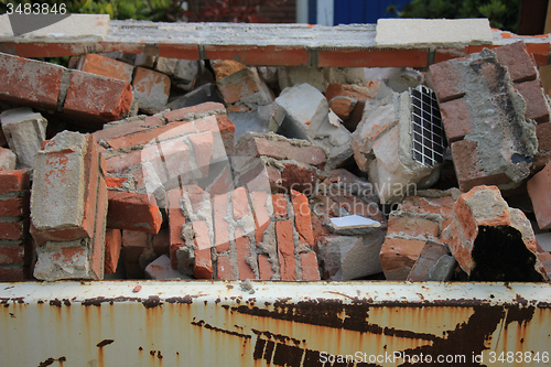 Image of Bricks in a dumpster