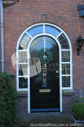 Image of Front door with Christmas decorations