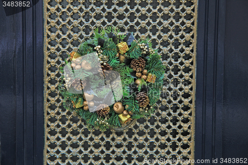 Image of christmas wreath with decorations on a door