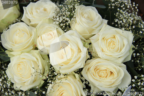 Image of White roses in bridal bouquet