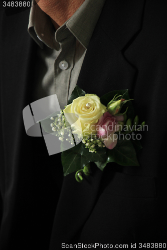 Image of Groom wearing boutonniere