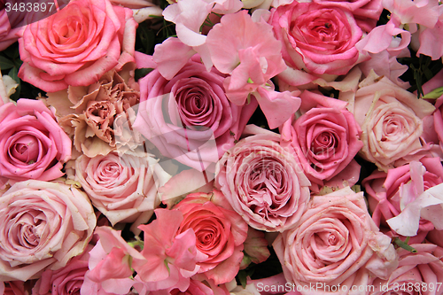 Image of Lathyrus and roses in a wedding bouquet