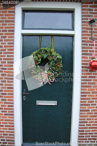 Image of Front door with Christmas decorations