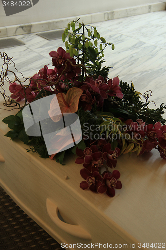 Image of Funeral flowers on a casket