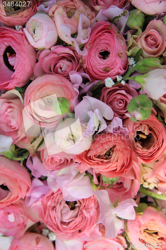 Image of Pink roses and ranunculus bridal bouquet