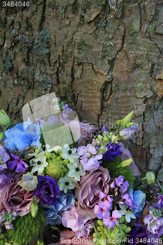 Image of Blue and purple wedding arrangement