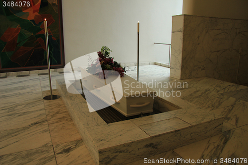 Image of White casket with funeral flowers