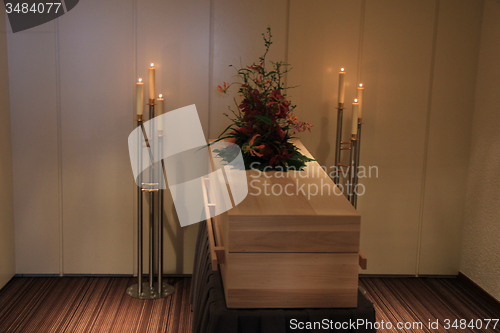 Image of Wooden casket in funeral home