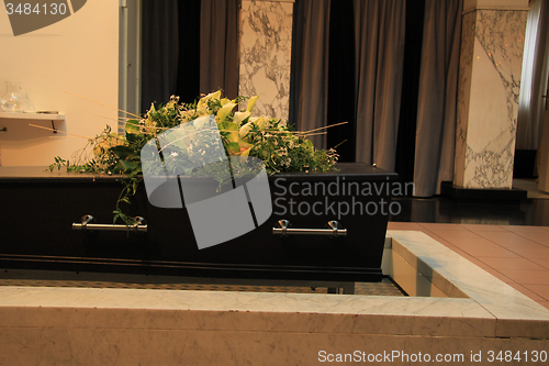 Image of Funeral flowers on a casket