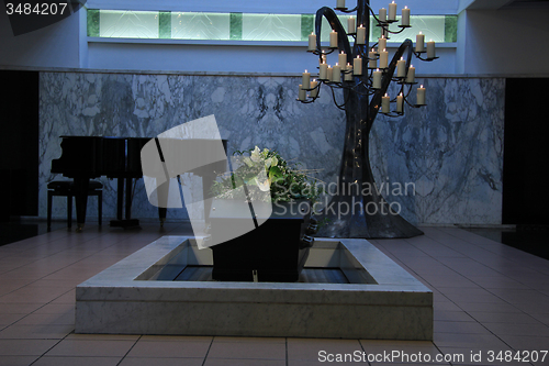 Image of Coffin with funeral flowers