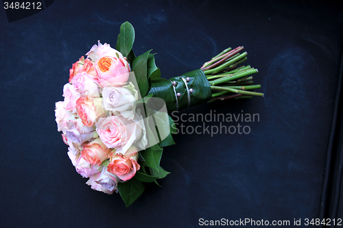 Image of Pastel roses in bridal bouquet