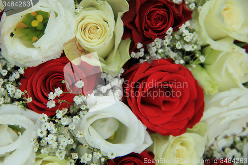 Image of Red and white roses in a bridal bouquet