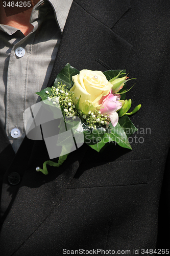 Image of Groom wearing boutonniere