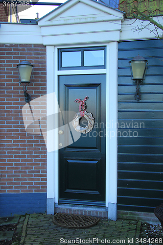 Image of Front door with Christmas decorations