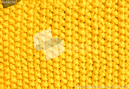 Image of Knitting in moss stitch with yellow yarn