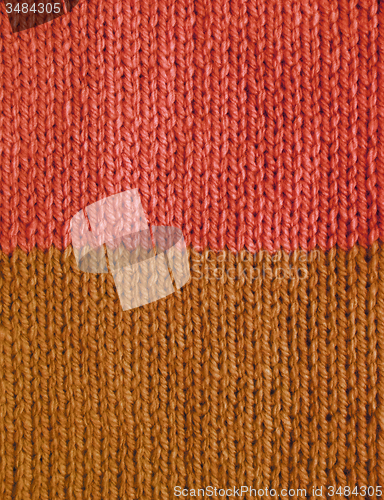 Image of Length of stockinette stitch knitting in pink and brown yarn