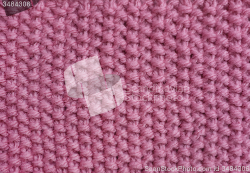 Image of Moss stitch knitting in pink wool 
