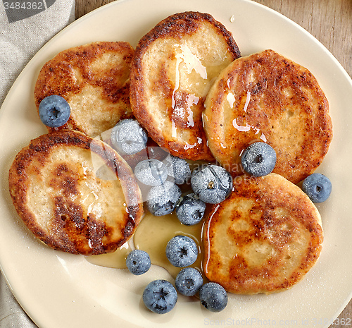 Image of Pancakes with honey and blueberries