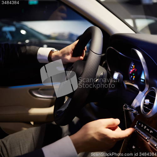 Image of hands on a steering wheel