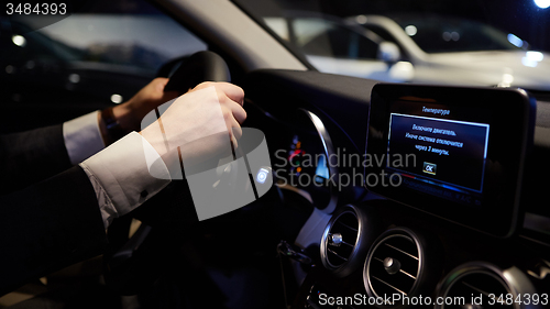 Image of hands on a steering wheel