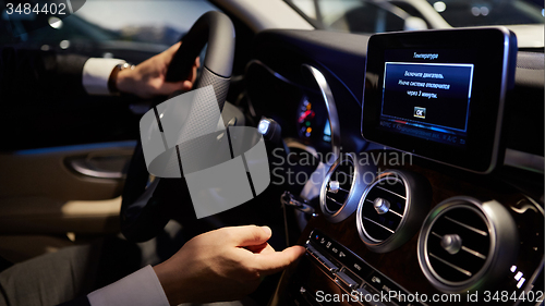 Image of hands on a steering wheel