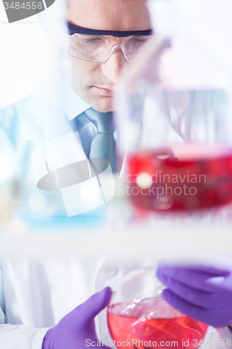 Image of Chemist searching for the right solution.