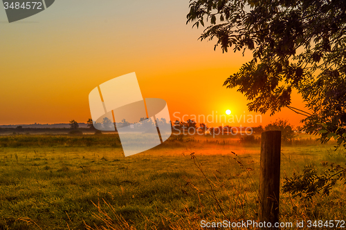 Image of Misty morning with a sunrise