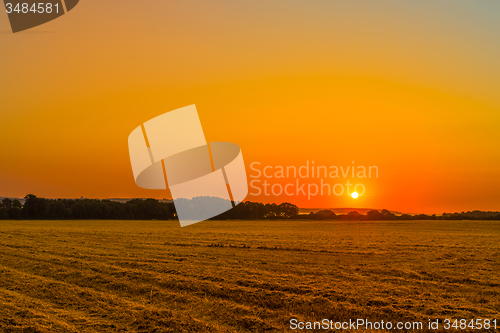 Image of Sunrise over a countryside field