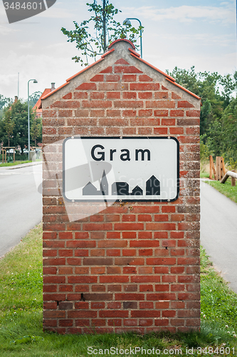 Image of Gram city sign on a brick post
