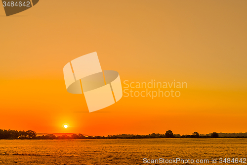 Image of Countryside landscape with a beautiful sunrise