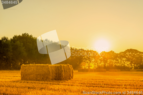 Image of Sunrise landscape with straw bales