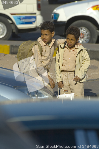 Image of Boys come back home from school