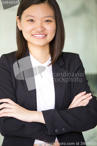 Image of Young Asian female business executive smiling portrait