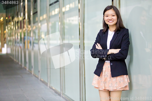 Image of Young Asian female business executive smiling portrait