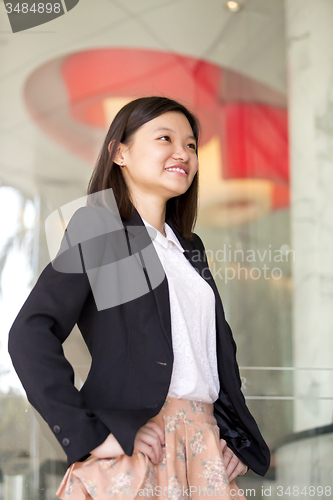 Image of Young Asian female business executive smiling portrait