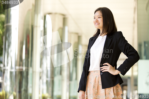 Image of Young Asian female business executive smiling portrait