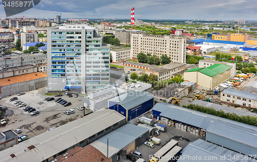 Image of Aerial view of office building and urban quarters