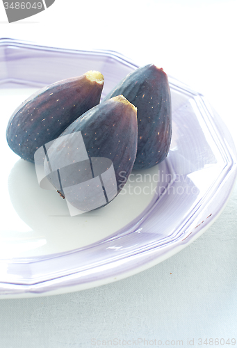 Image of Group of colored figs on the colorful background